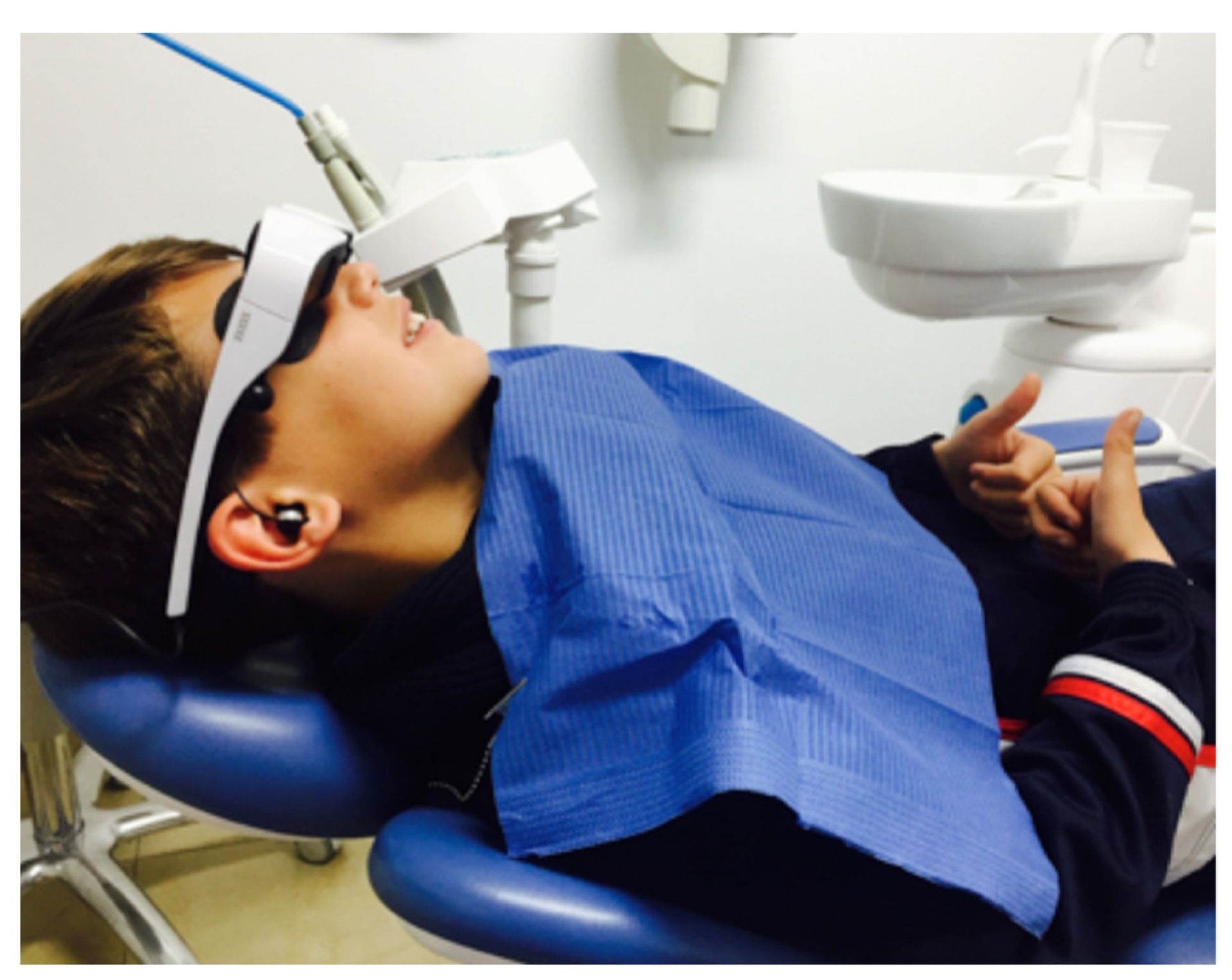 patient using VR headset in a dental chair